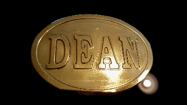 brass oval name belt buckle